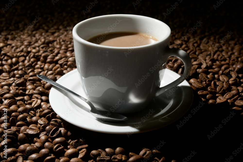 Cup with coffee, costing on coffee grain Cup with coffee, costing on coffee grain