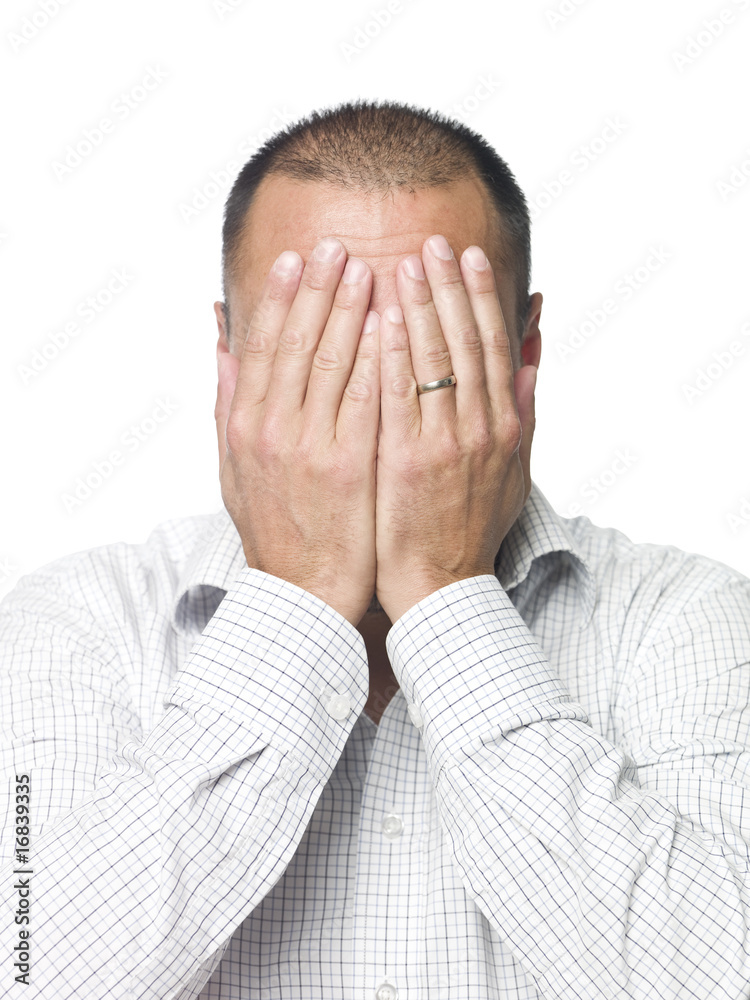 Portrait of a man hiding in his hands Portrait of a man hiding in his hands