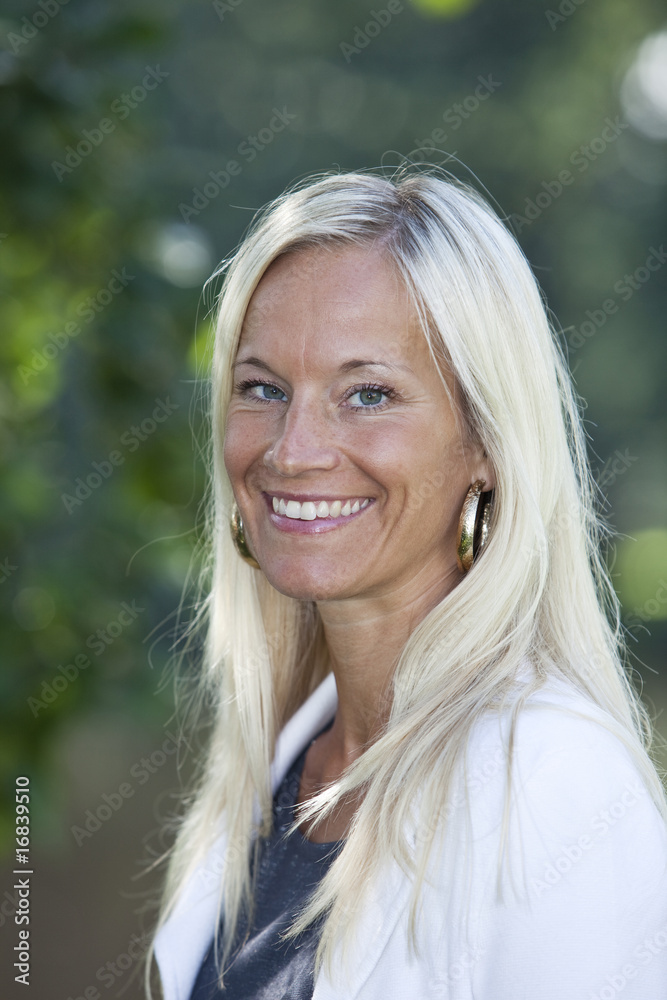 Portrait of a blonde woman smiling. Portrait of a blonde woman smiling.