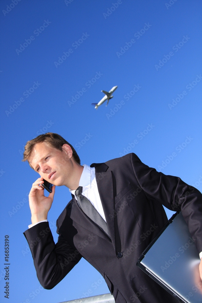 Young Professional with laptop and cellphone Young Professional with laptop and cellphone