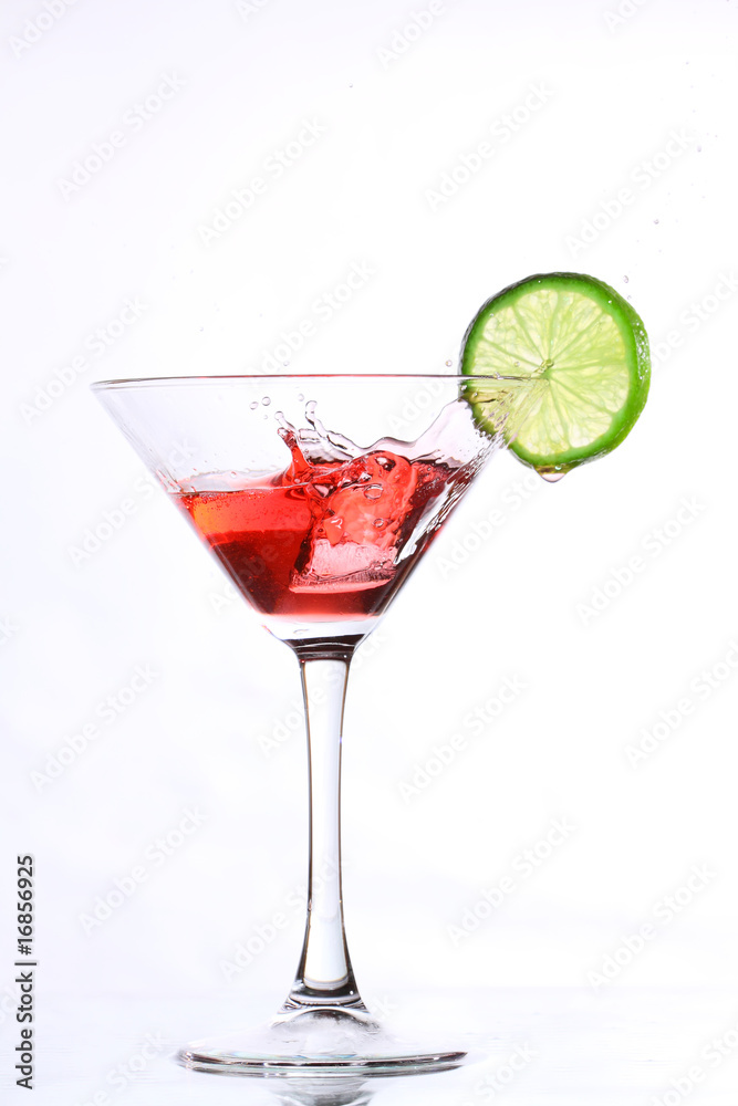 red cocktail with lime on white red cocktail with lime on white