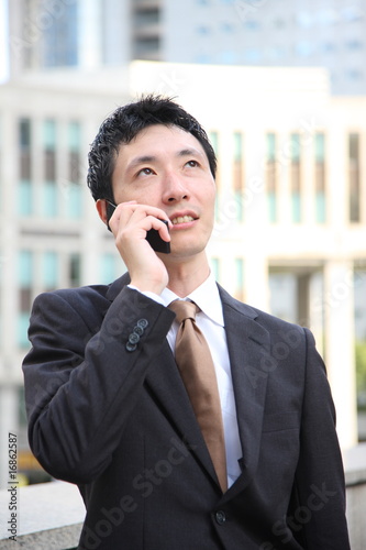 Businessman talks with a cellular phone