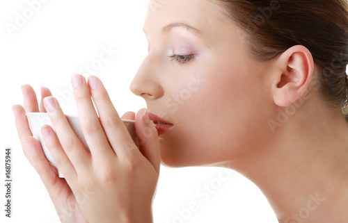 Woman with clean face drinking grean tea