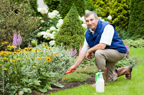 Man raking garden
