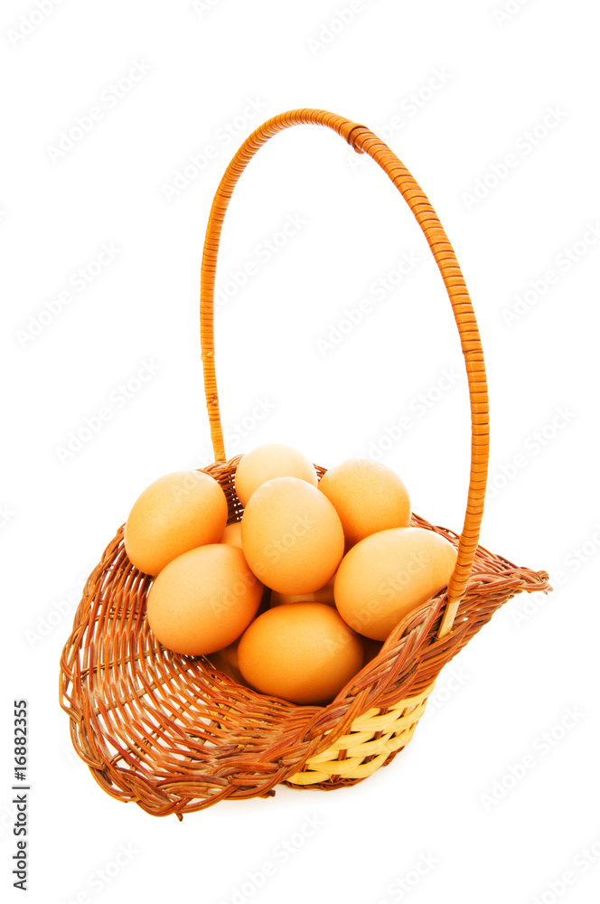 Basket full of eggs isolated on white Basket full of eggs isolated on white
