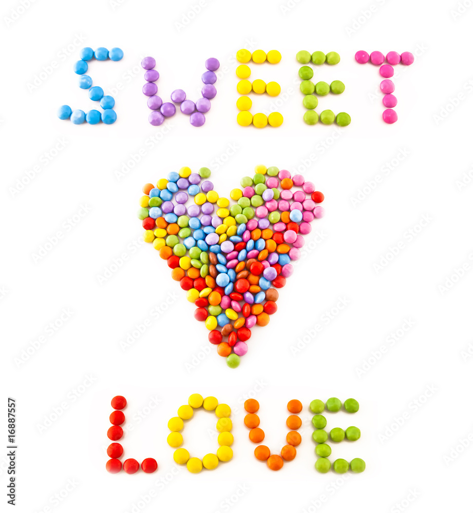 Inscription love from multi coloured chocolate candy
