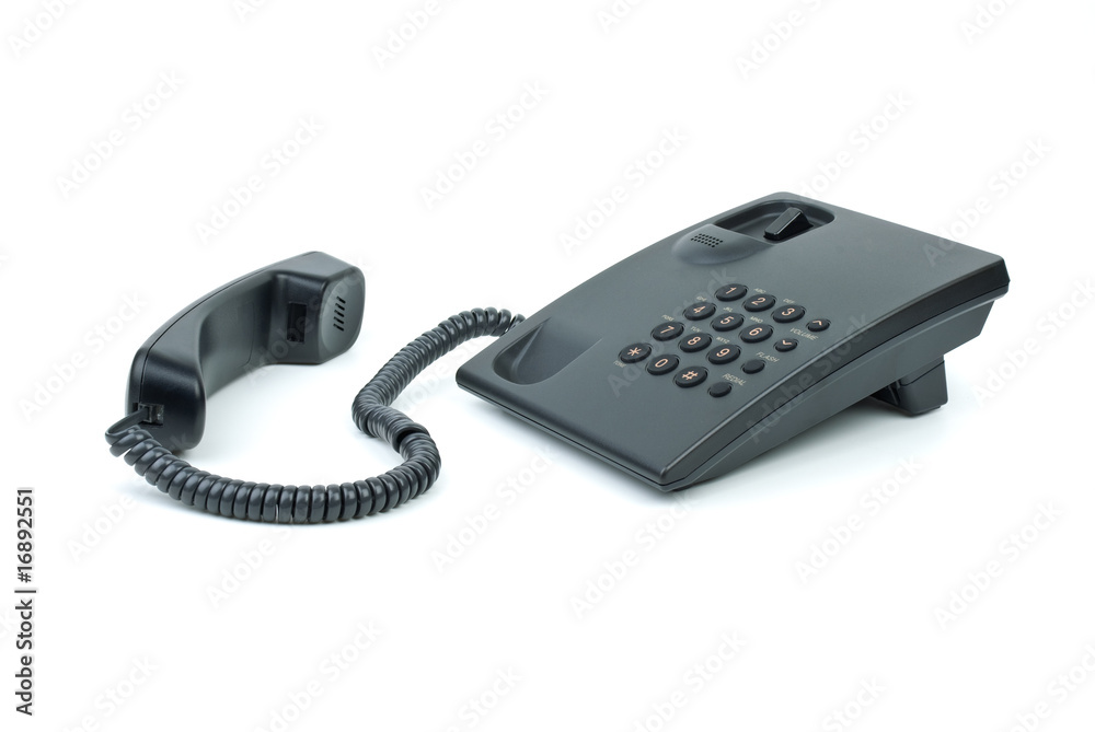 Black office phone with handset near Black office phone with handset near