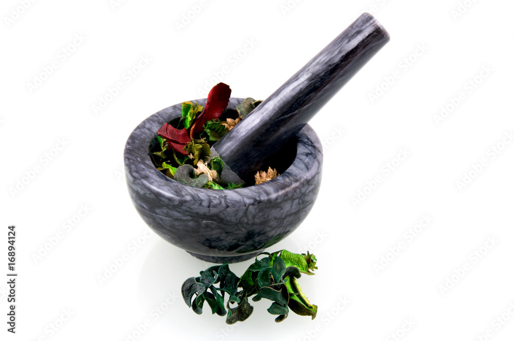 Black marble mortar with herbs