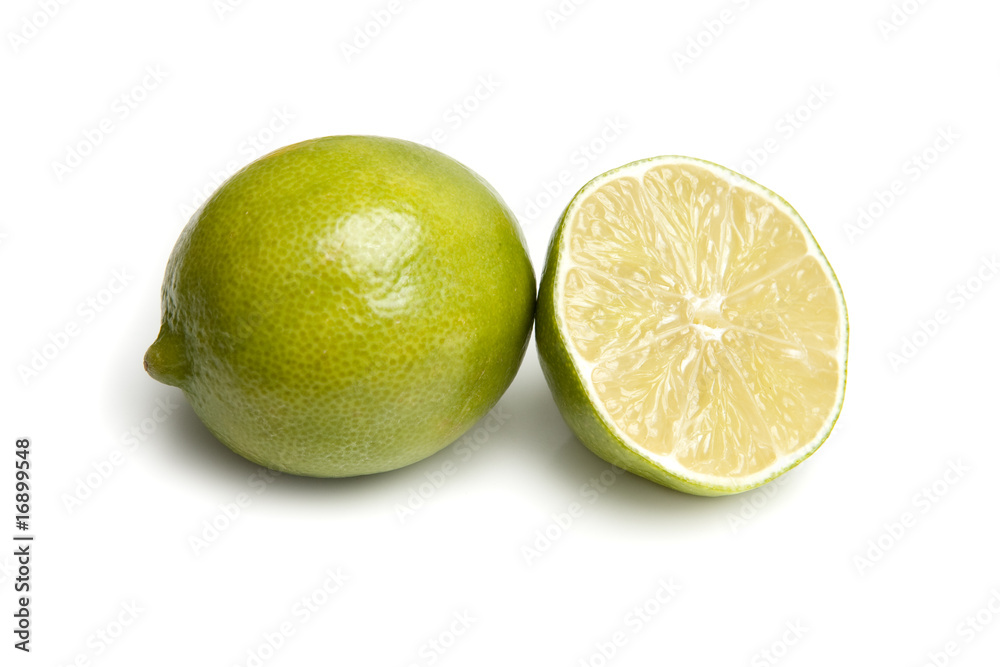 Lime and Sliced Lime Half on White Background