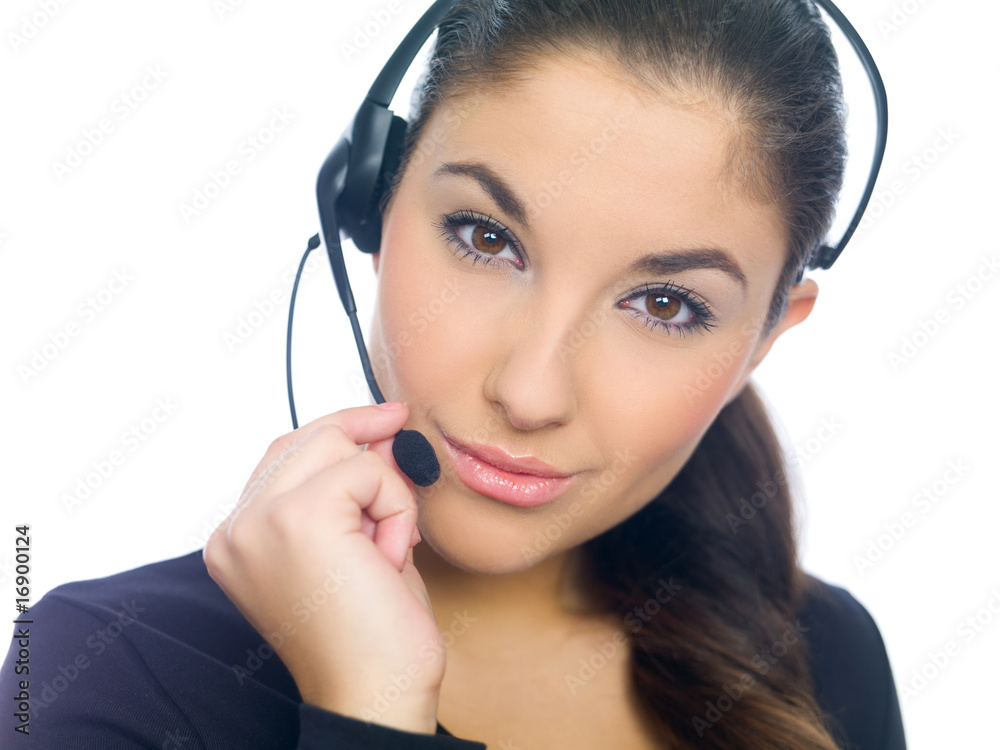 Beautiful girl is using headset, isolated on white Beautiful girl is using headset, isolated on white
