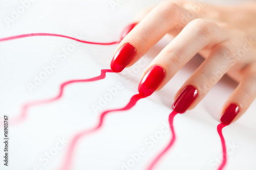 Young woman hand with red traces