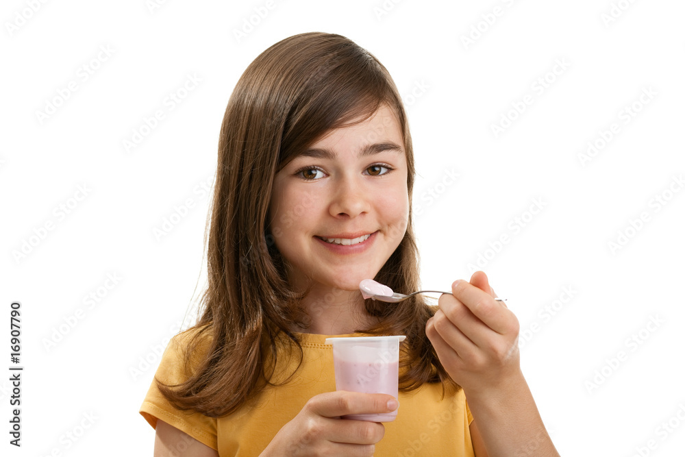 Girl eating yogurt isolated on white background Girl eating yogurt isolated on white background