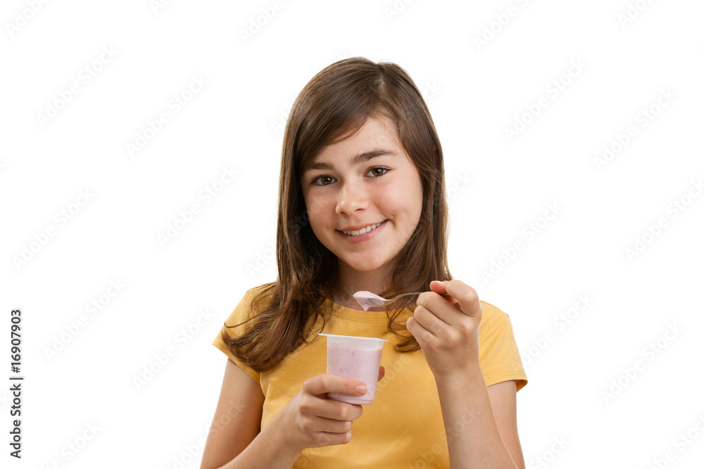 Girl eating yogurt isolated on white background Girl eating yogurt isolated on white background