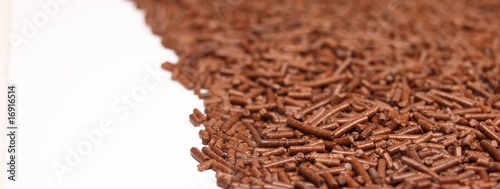 Fototapeta Naklejka Na Ścianę i Meble -  Chocolate granules background, low depth of focus