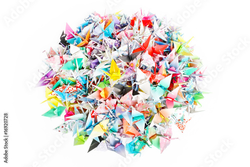 A circle pile of paper cranes isolated on a white background