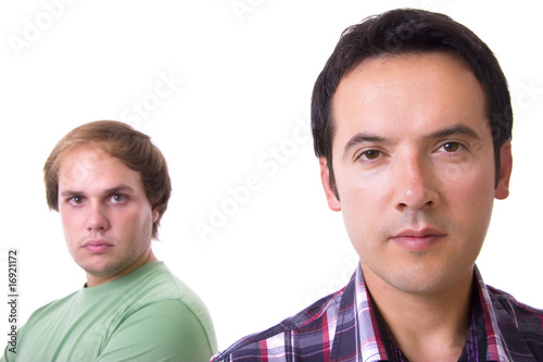 Two casual men posing, isolated over white background