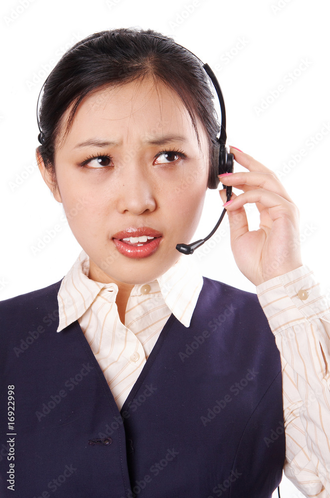 Call center operator with annoyed expression. Call center operator with annoyed expression.