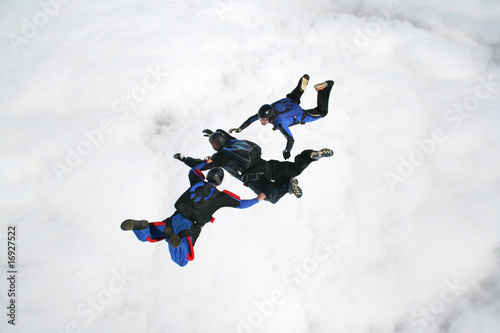 Three skydivers in freefall