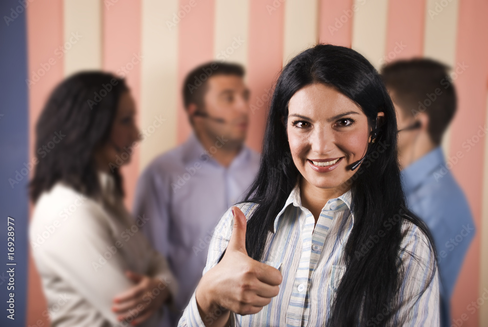 Happy call center woman giving thumbs up Happy call center woman giving thumbs up
