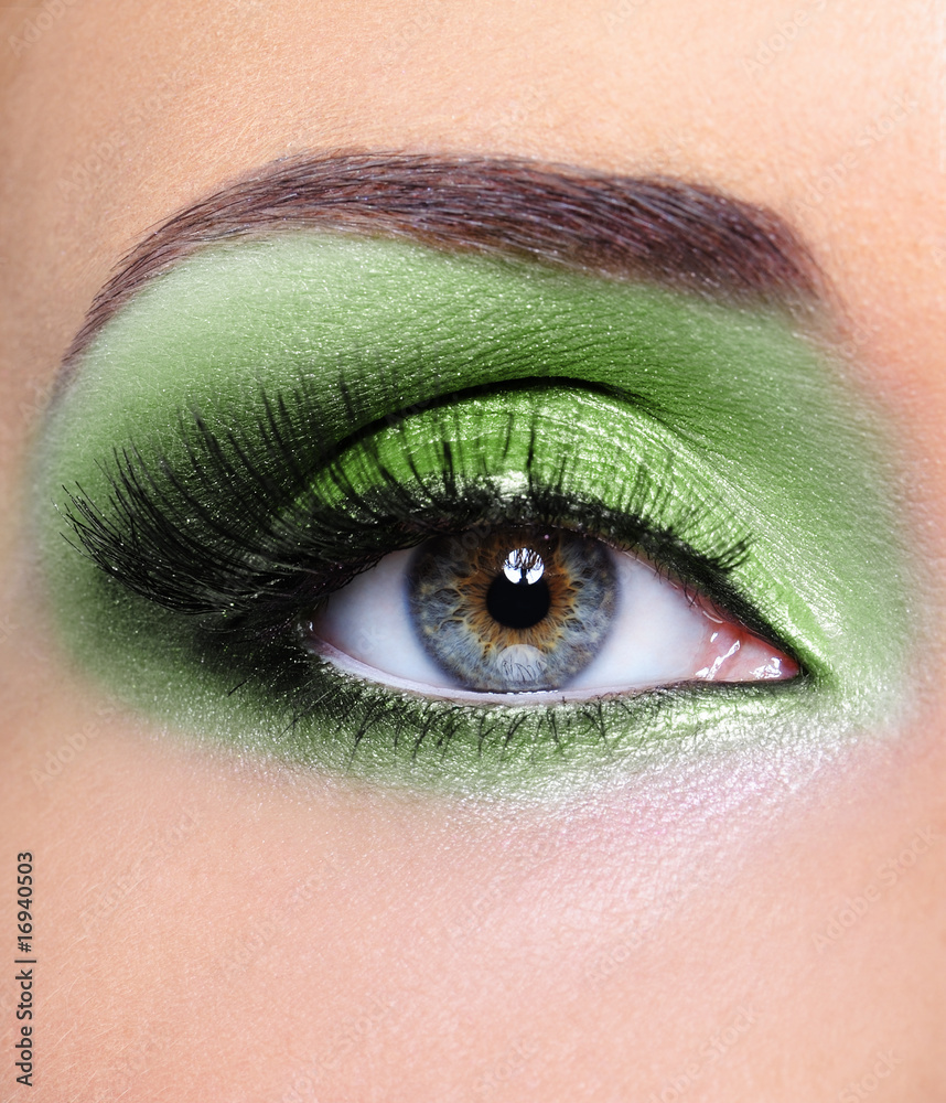 Fototapeta premium Green make-up of woman eye