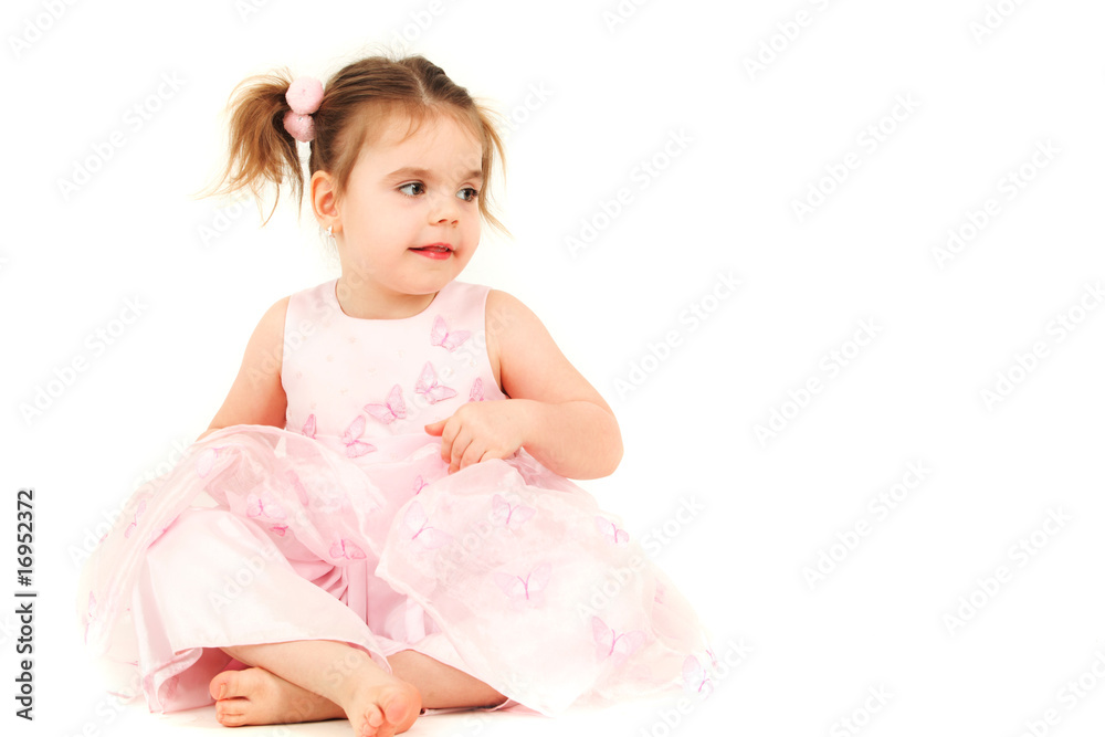 Portrait of young girl in pink princess dress, studio shot
