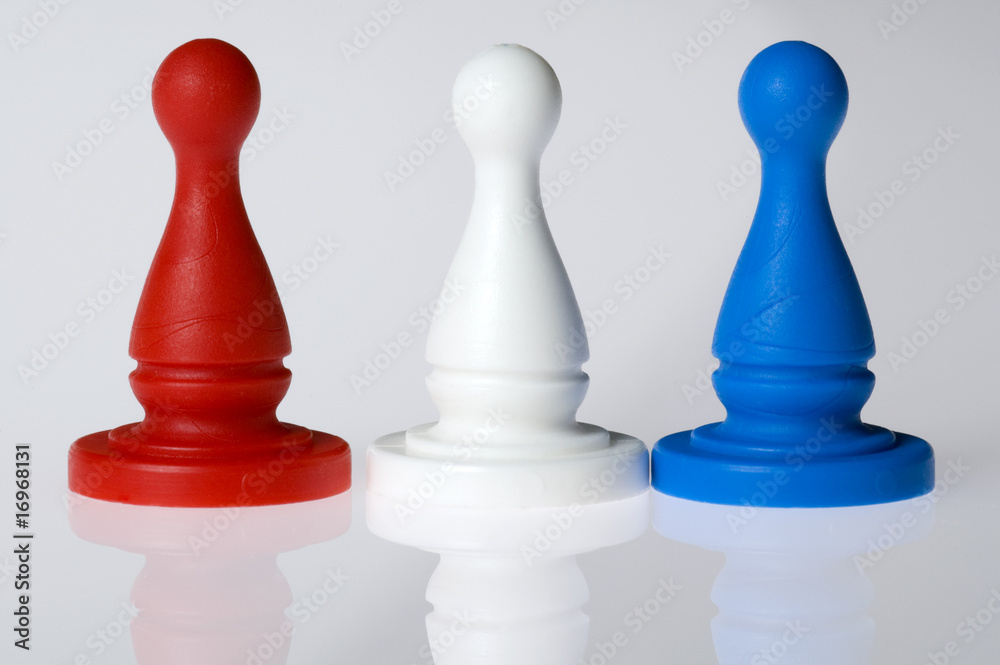 Three board game pieces