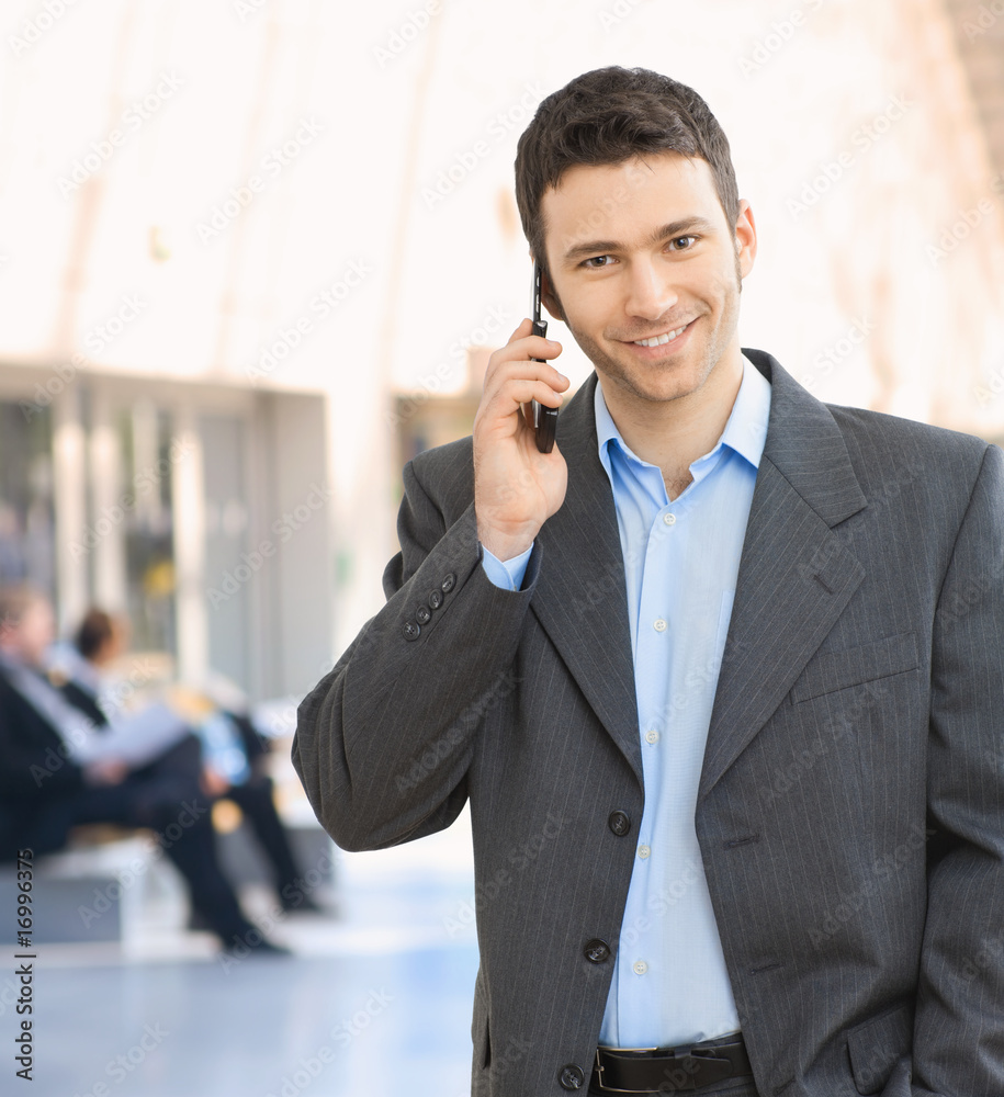 Happy businessman talking on mobile Happy businessman talking on mobile