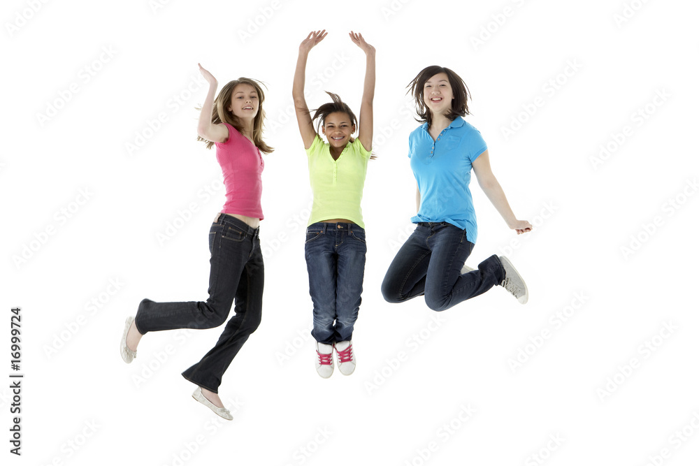 Group of Teenage Girlfriends Jumping in Studio Group of Teenage Girlfriends Jumping in Studio