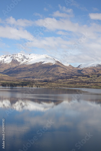 Mountains reflected in clear lake