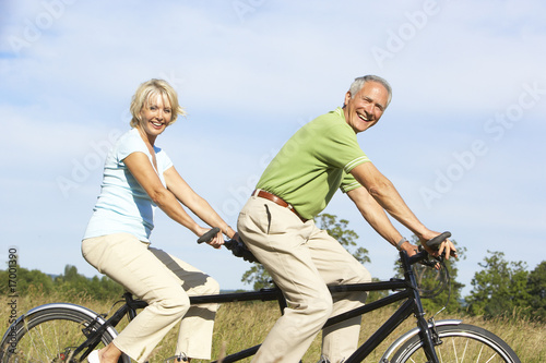 Mature couple riding tandem