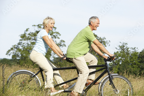 Mature couple riding tandem