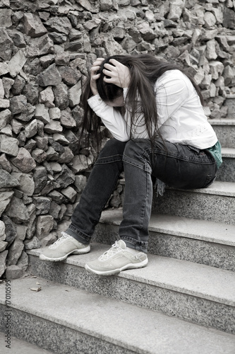 Teens problems. Young woman alone at the city