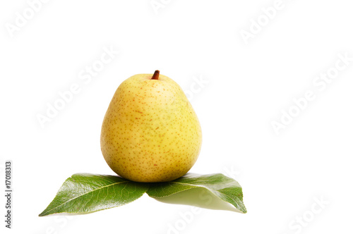 Juicy pear and green leaves on a white.