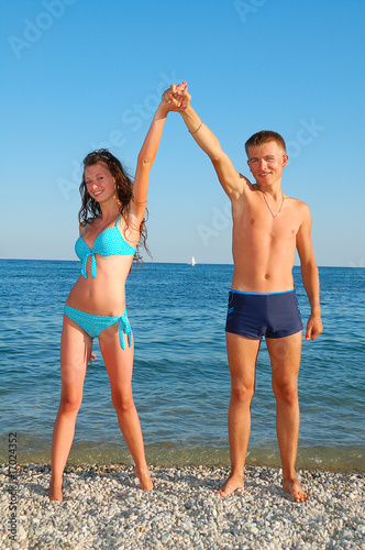 young couple on summer beach © vnlit