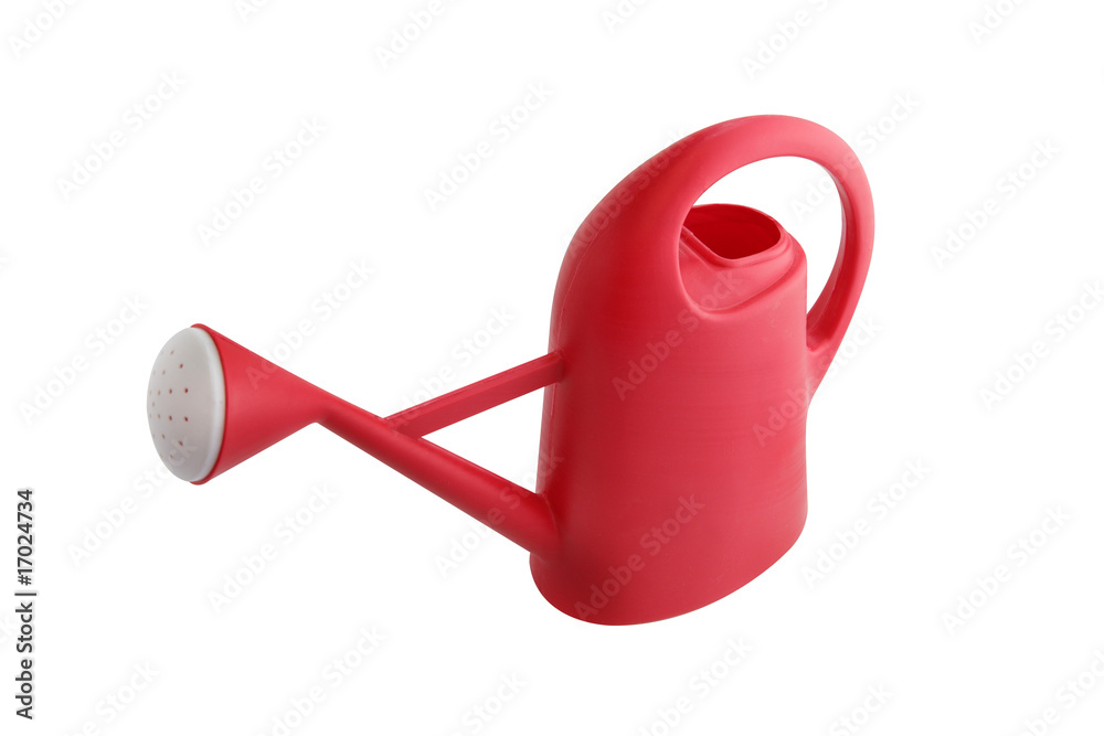 Arrosoir rouge en plastique pour enfant sur fond blanc Arrosoir rouge en plastique pour enfant sur fond blanc