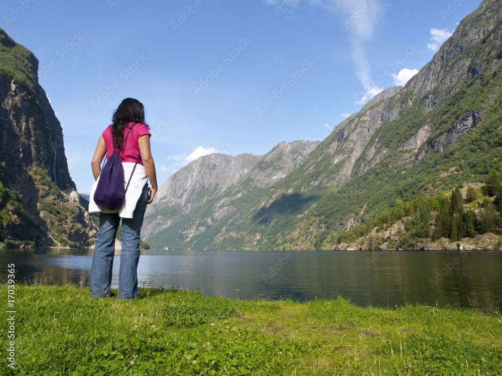 Woman relaxing in the fjord of Gudvangen