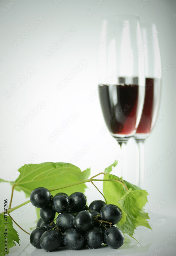 Black grapes and tall wine glasses Black grapes and tall wine glasses