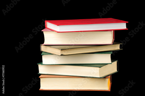 Stack of books isolated over black background