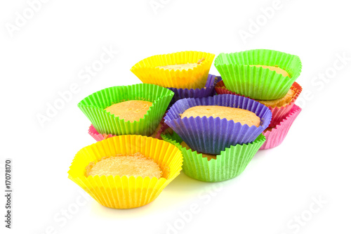 Home made cupcakes over white background