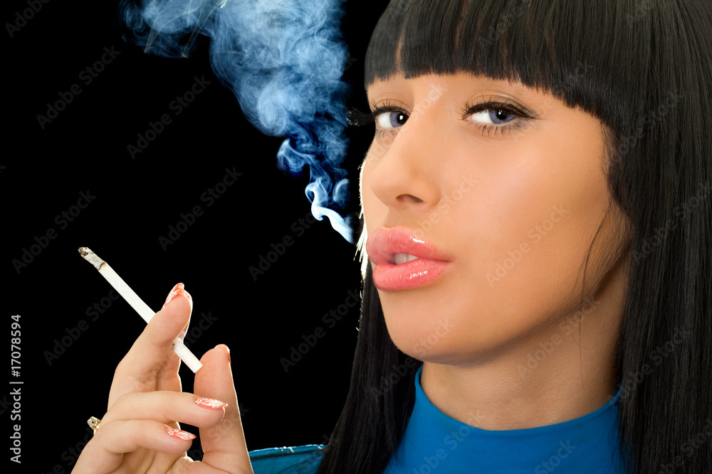 Fototapeta premium Portrait of the cute woman with a cigarette