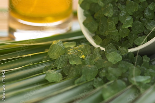 bath salt, oil and palm leaf