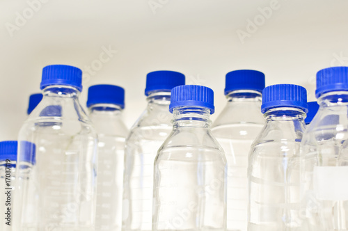 View of empty bottles with blue cap used in scientific research