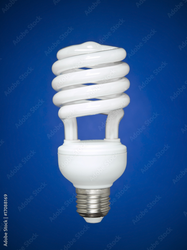 Fluorescent light bulb over blue Fluorescent light bulb over blue