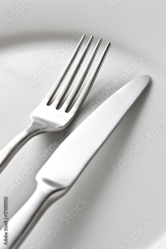 Fork and Knife on White Plate