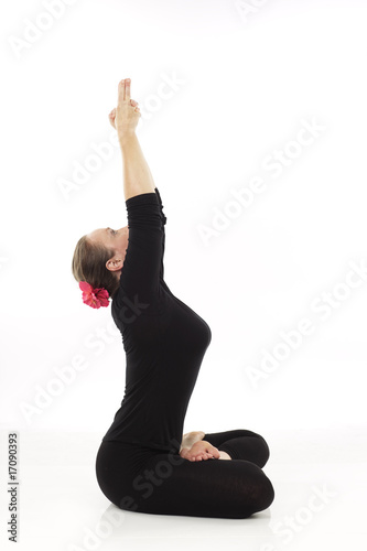 woman doing yoga against white background