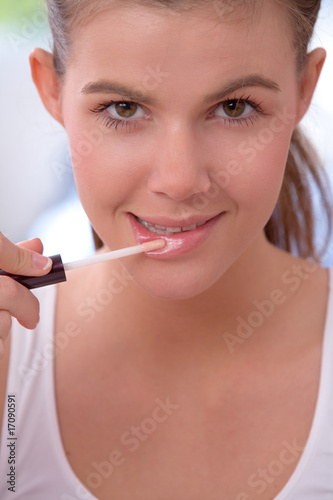 Applying lip gloss