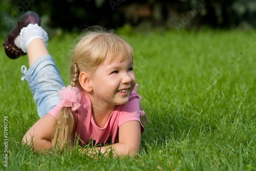 Cute little girl in grass.