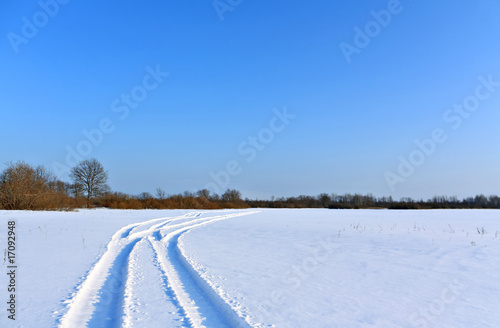 winter road through field © Sergey YAkovlev