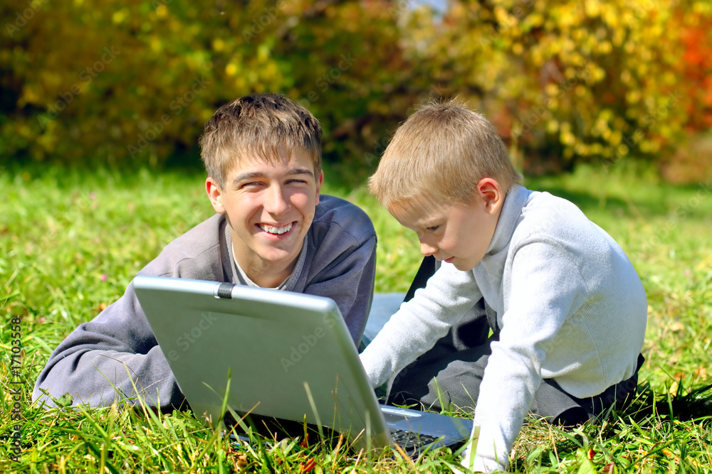 brothers with notebook on the meadow brothers with notebook on the meadow