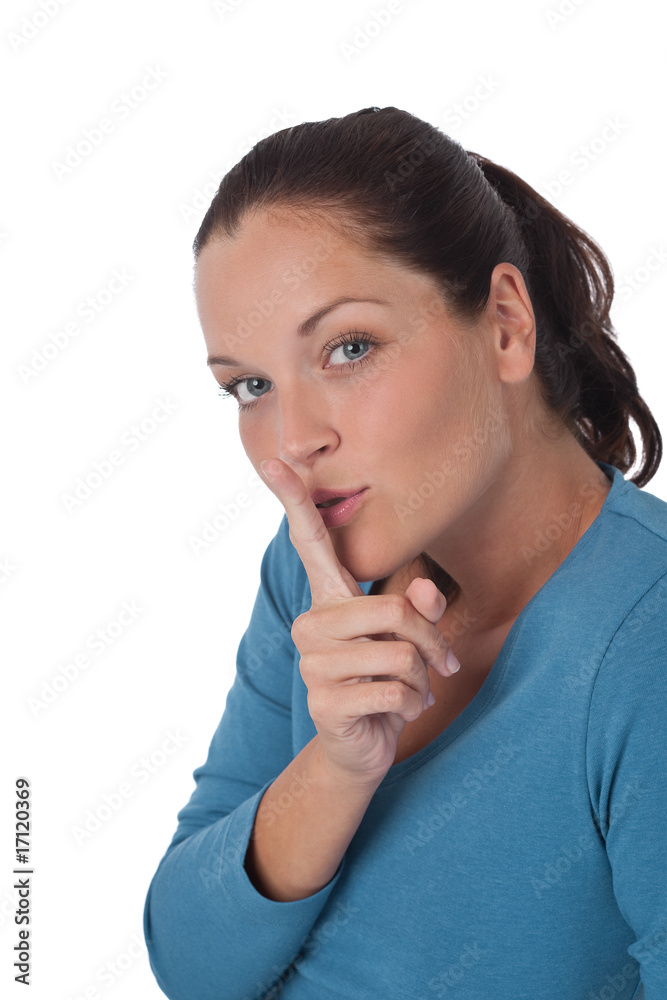 Beautiful young woman with finger on lips Beautiful young woman with finger on lips